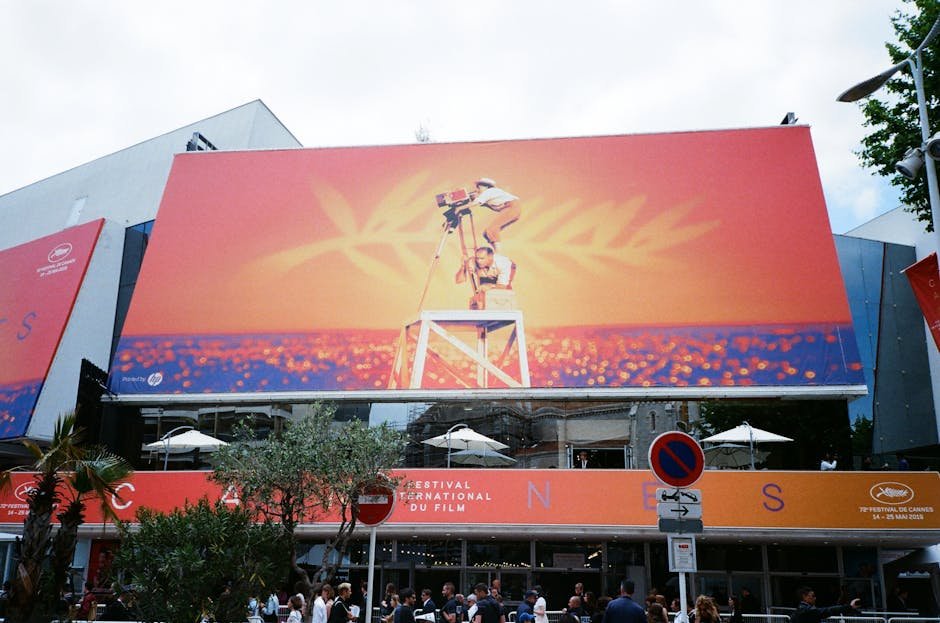 Large billboard at the Cannes Film Festival showcasing vibrant imagery.